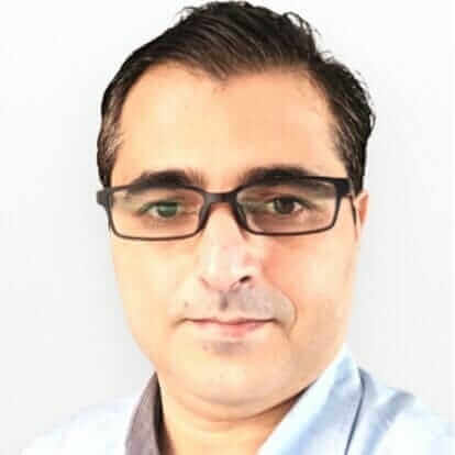 Man with glasses and short dark hair