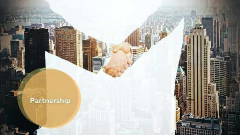 Business handshake over city skyline, partnership concept.