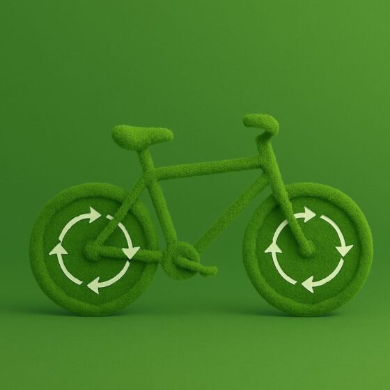 Green bicycle covered in grass texture with arrows